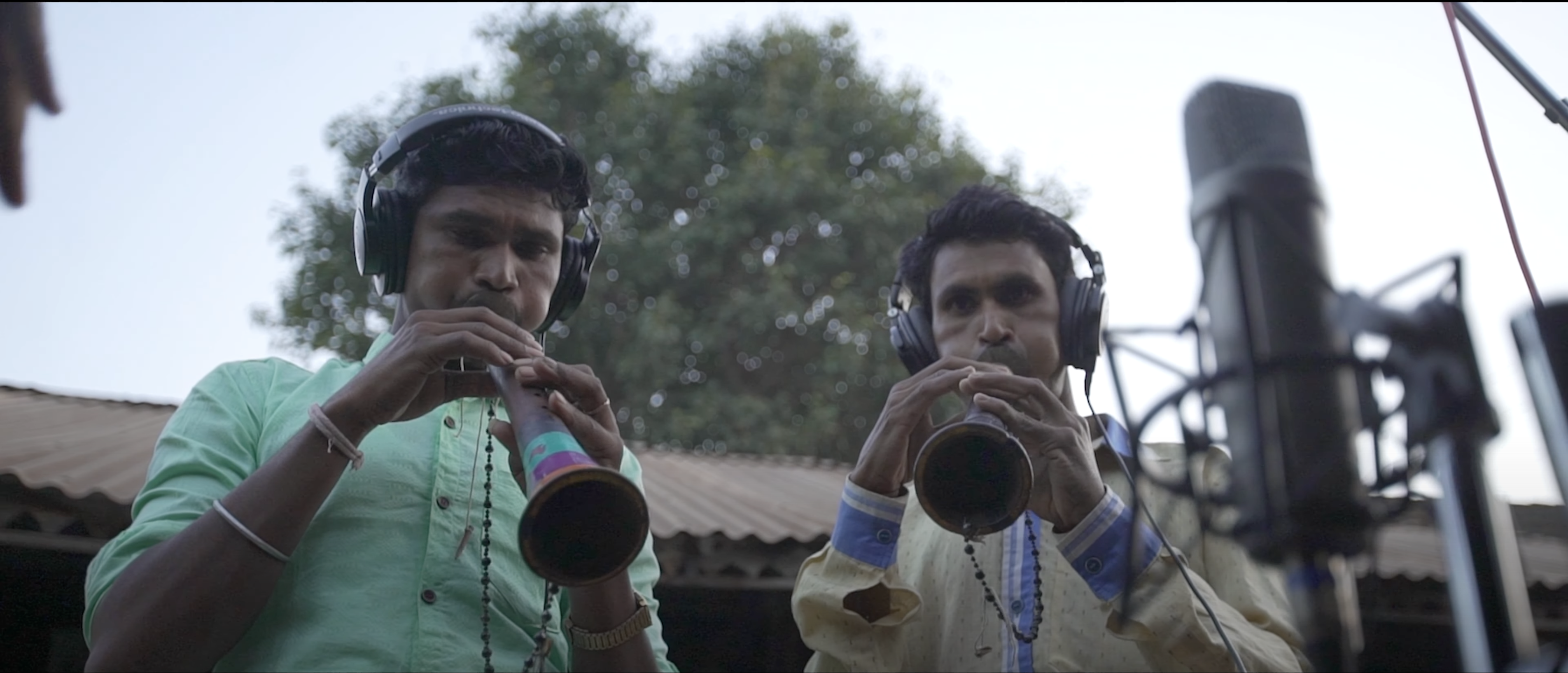 Adivasi musicians recording the shehnai on the front porch of the house. (Photo by Akshat Vijayvargiya)