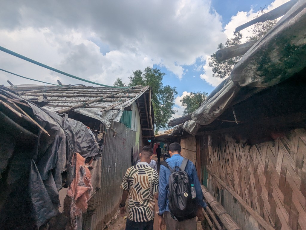 People walk in a Rohingya refugee camp